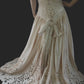 back view of dress. light golden colour. corset back ending in outsize bow. 